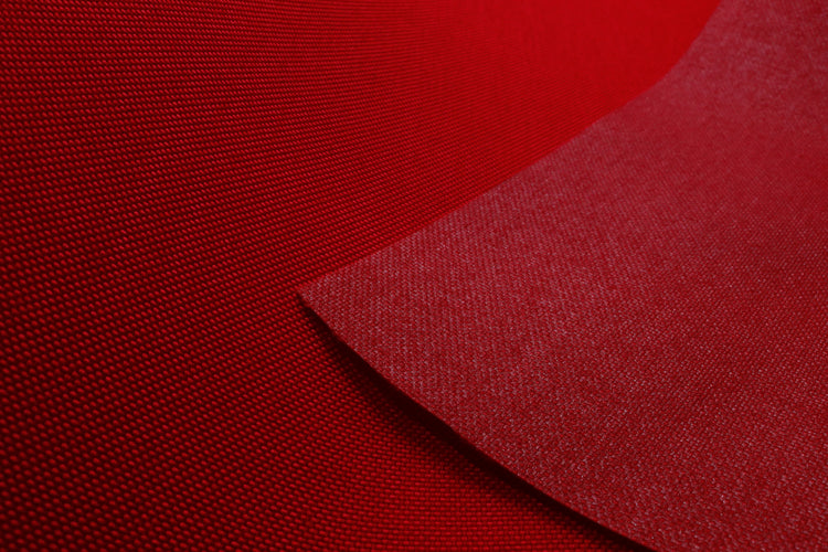Close-up of red colored Cordura Classic 1000D nylon 6.6 fabric texture
