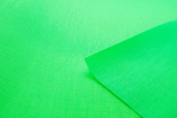 Close-up of neon green colored Cordura Classic 1000D nylon 6.6 fabric texture