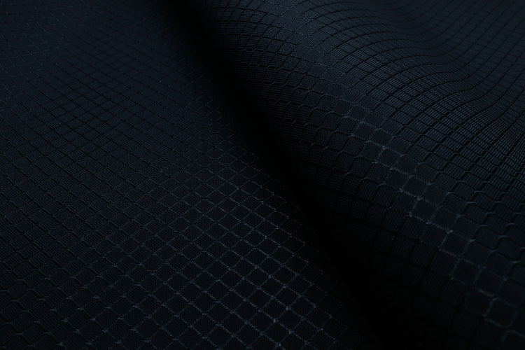 close-up of black diamond ripstop nylon fabric