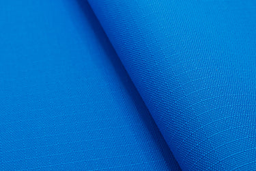Close-up of RBC450 RS fabric surface, highlighting the subtle ripstop weave and durable recycled fibers.