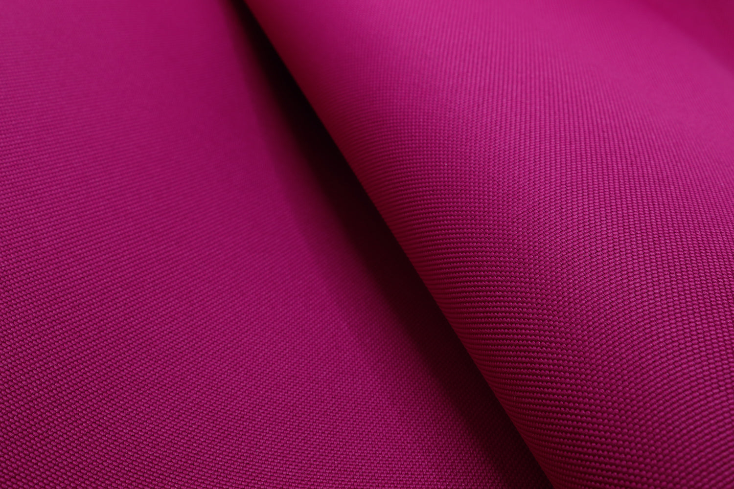 Fuschia RE/COR™ Cordura® recycled nylon fabric shown on a white background, built for durable DIY packs and gear.