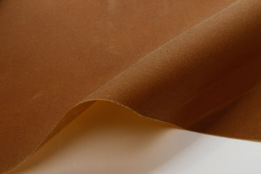 close up of a tan waxed canvas showing the texture