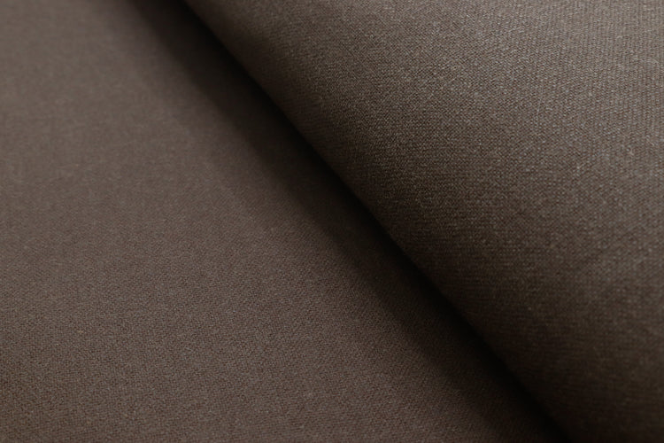 Close-up of waxed canvas showing natural creases and texture, perfect for handcrafted gear with character.