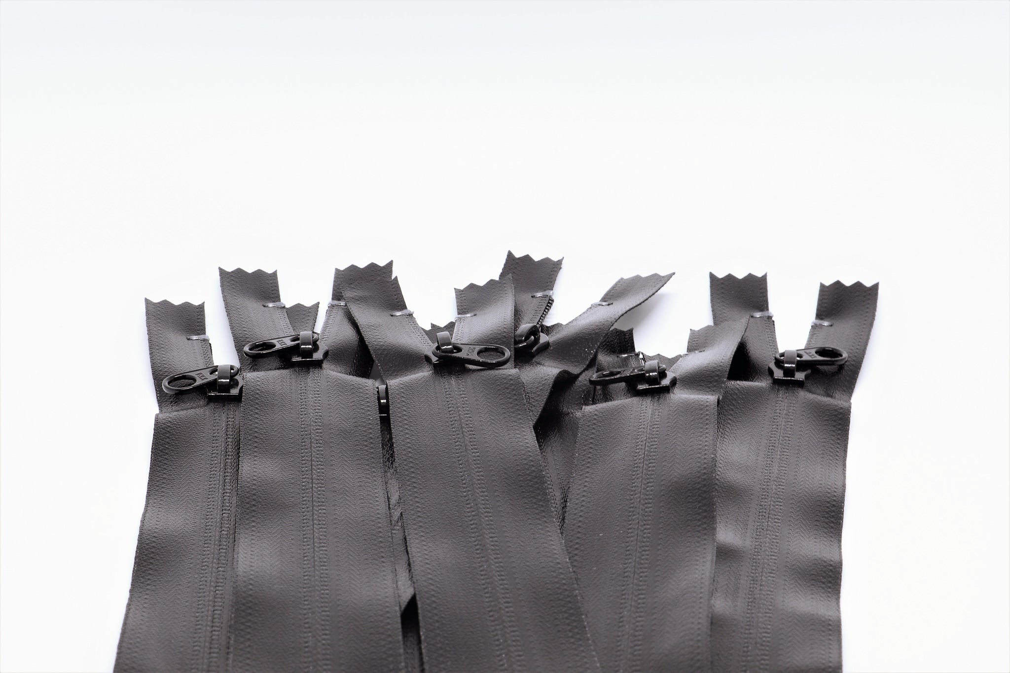 multiple Closed-end YKK AquaGuard Zipper. Water resistant zippers available in bulk and custom specifications.