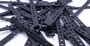 Tiny straps used to fasten items and keep them secure