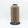 Cone of lubricated polyester thread made from pre-stabilised high tenacity continuous filament polyester in sand beige