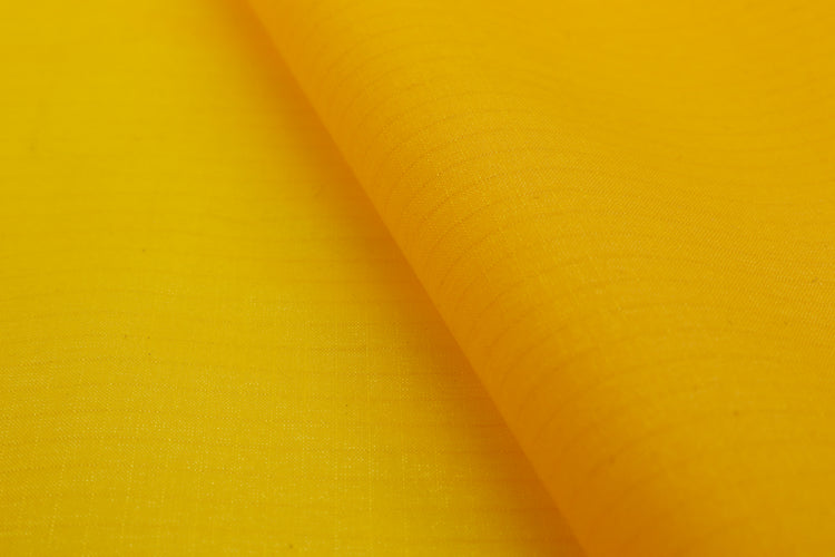 Ripstop silnylon close up of texture and ripstop weave in yellow