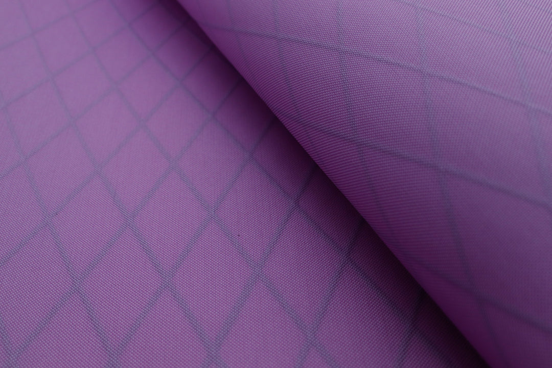 Close up of X-PAC VX21 pack fabric in mulberry to show the texture and x-ply ripstop pattern of the fabric