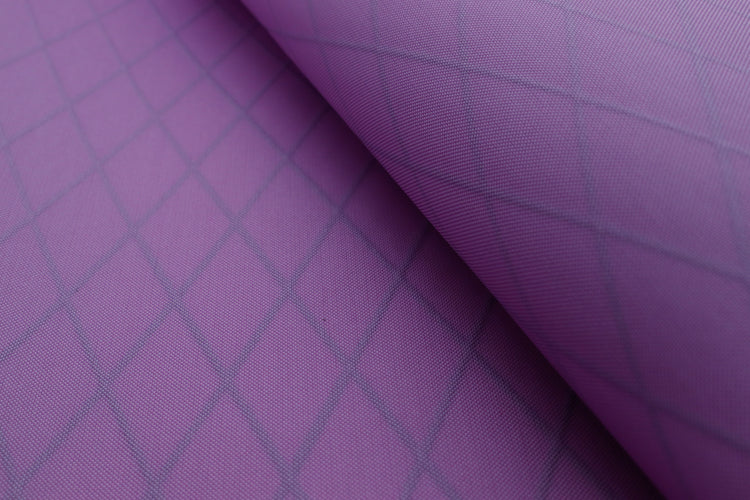 Close up of X-PAC VX21 pack fabric in mulberry to show the texture and x-ply ripstop pattern of the fabric