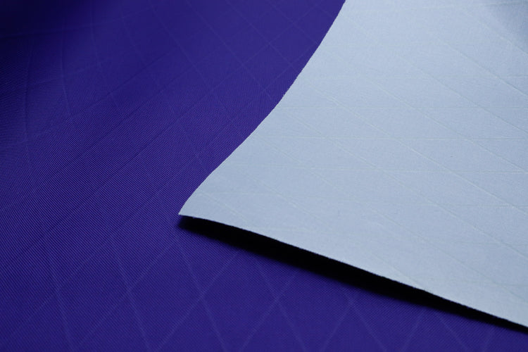 X-PA VX21 nylon pack fabric in purple. Close up showing the x-ply ripstop pattern