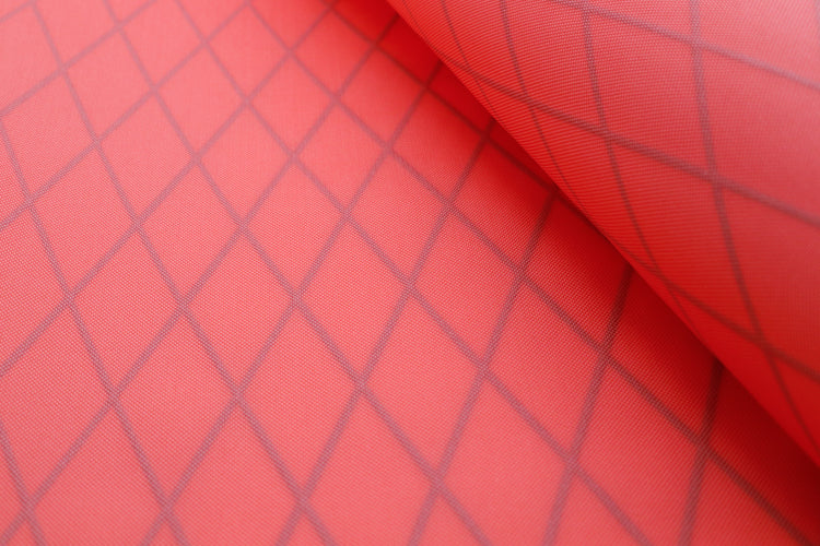 X-PAC VX21 nylon pack fabric in coral close up showing the x-ply ripstop pattern in the fabric