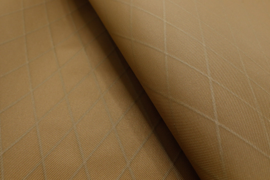 Close up of X-PAC VX21 ripstop nylon fabric in coyote brown showing the x-ply ripstop pattern of the fabric
