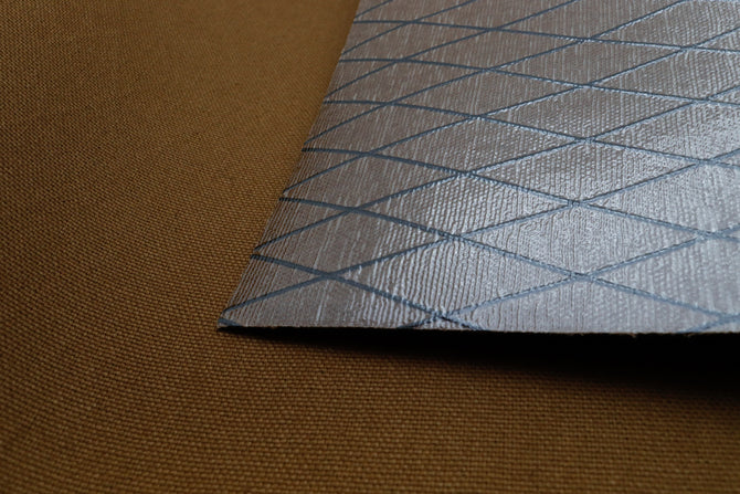 Close up of X-PAC X11 cotton duck pack fabric showing the texture and ripstop x-ply grid in mountain brown