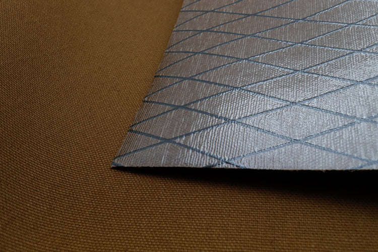 Close up of X-PAC X11 cotton duck pack fabric showing the texture and ripstop x-ply grid in mountain brown