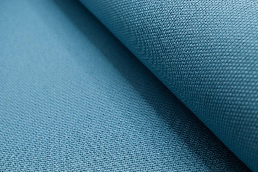 Close p view of X-PAC X11 cotton duck fabric in glacier blue showing the x-ply ripstop grid of the fabric
