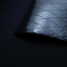 X-PAC X11 cotton duck pack fabric in black showing the texture and the ripstop x-ply grid in the fabric