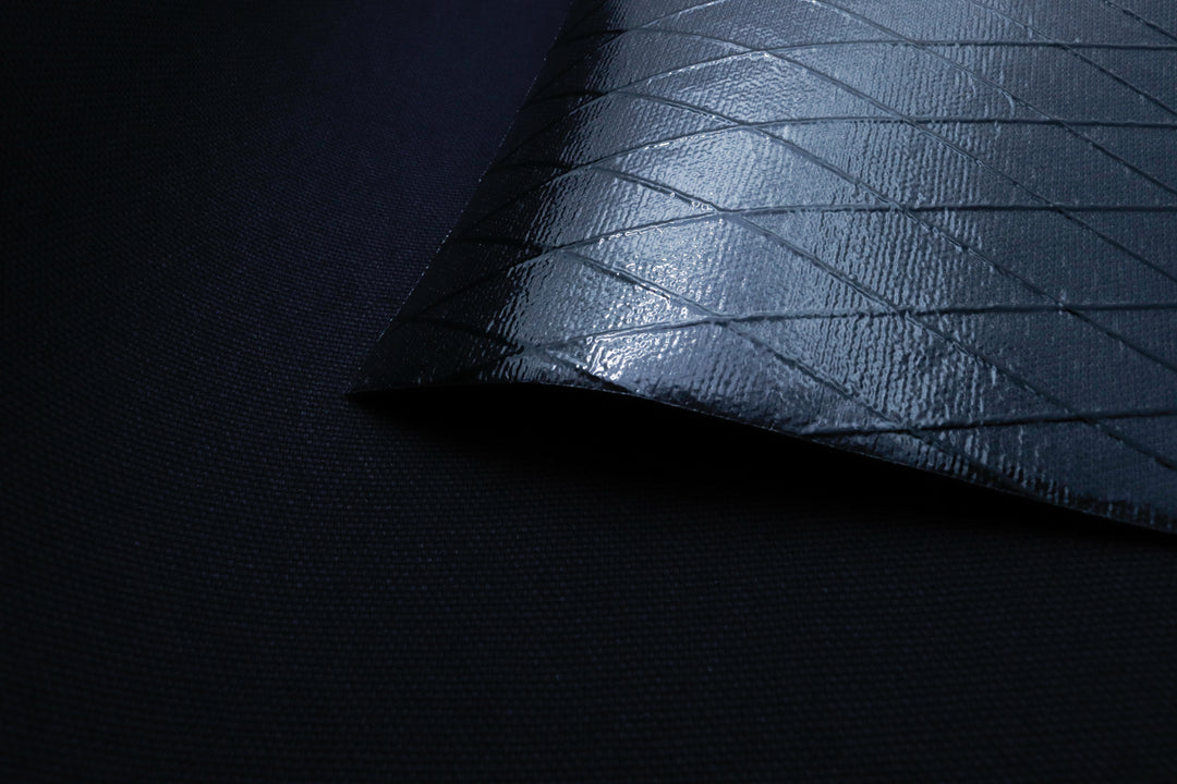 X-PAC X11 cotton duck pack fabric in black showing the texture and the ripstop x-ply grid in the fabric
