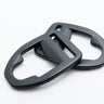 Two gray metal d-rings on a white background
