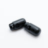 black plastic cord locks on a white background for making your own outdoor gear