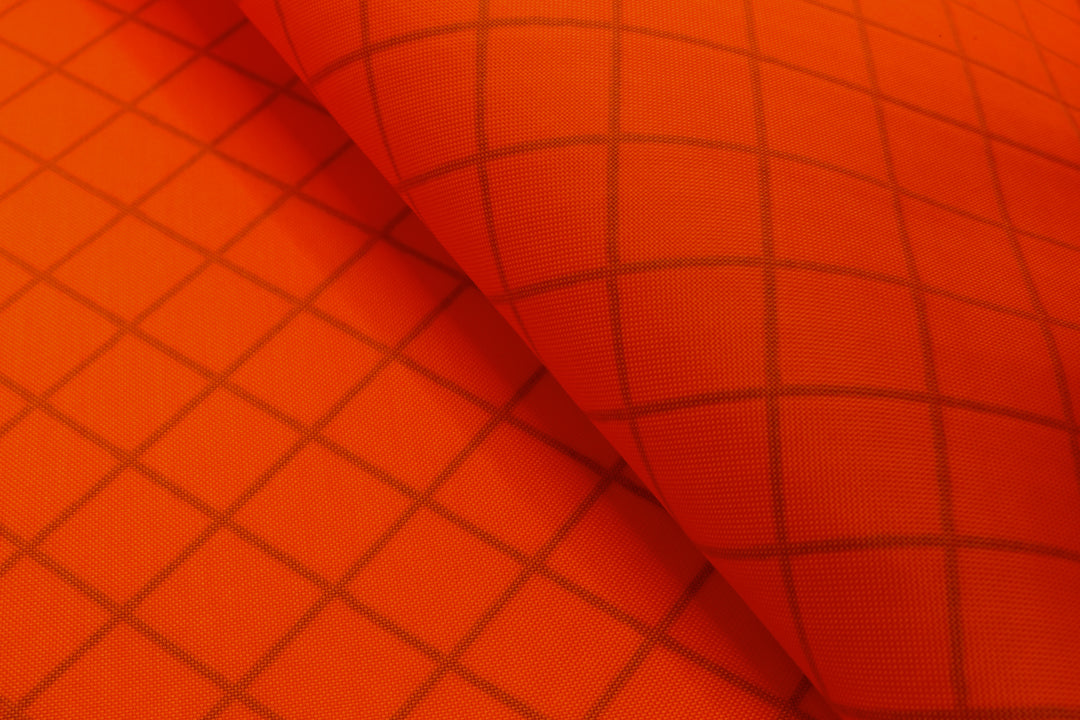 Bright orange EPX200 waterproof and recycled fabric for backpacks, bike bags, and outdoor gear.