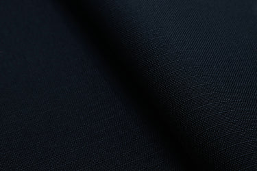 Close-up of RBC450 RS fabric surface, highlighting the subtle ripstop weave and durable recycled fibers.