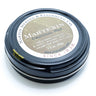 A tin of refinishing wax for waxed canvas fabrics