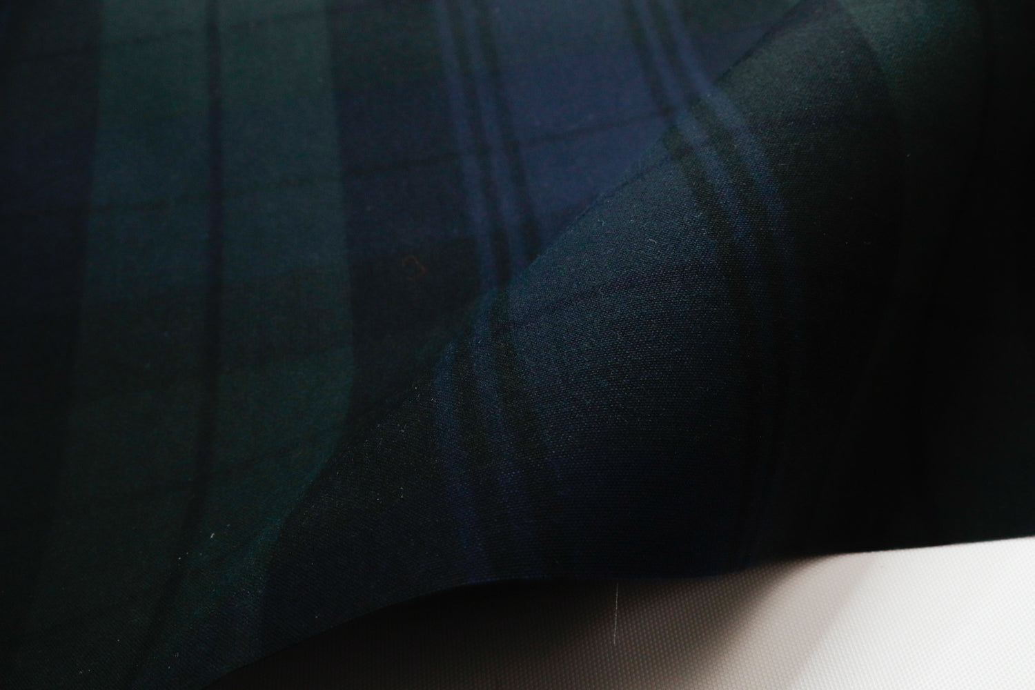 close up of 6.75 oz waxed canvas in a plaid pattern for bags and other sewing projects
