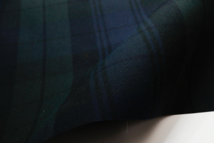 close up of 6.75 oz waxed canvas in a plaid pattern for bags and other sewing projects