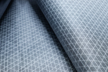 Close up of the front of Ultra80x UHMWPE ripstop fabric for sewing and making your own gear. 