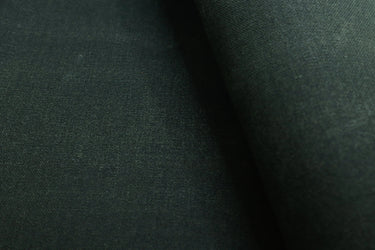 Army olive waxed canvas fabric used for sewing backpacks, bags, and outdoor gear.