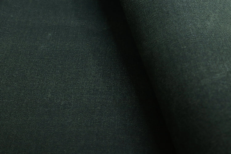 Army olive waxed canvas fabric used for sewing backpacks, bags, and outdoor gear.