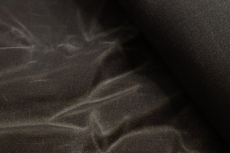 wrinkled water-resistant waxed canvas fabric used for sewing backpacks, bags, and outdoor gear.