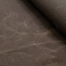 Close-up of waxed canvas showing natural creases and texture, perfect for handcrafted gear with character.