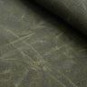 Close-up of waxed canvas showing natural creases and texture, perfect for handcrafted gear with character.