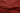 A close up of a rustic red waxed canvas showing the crinkled texture and finish