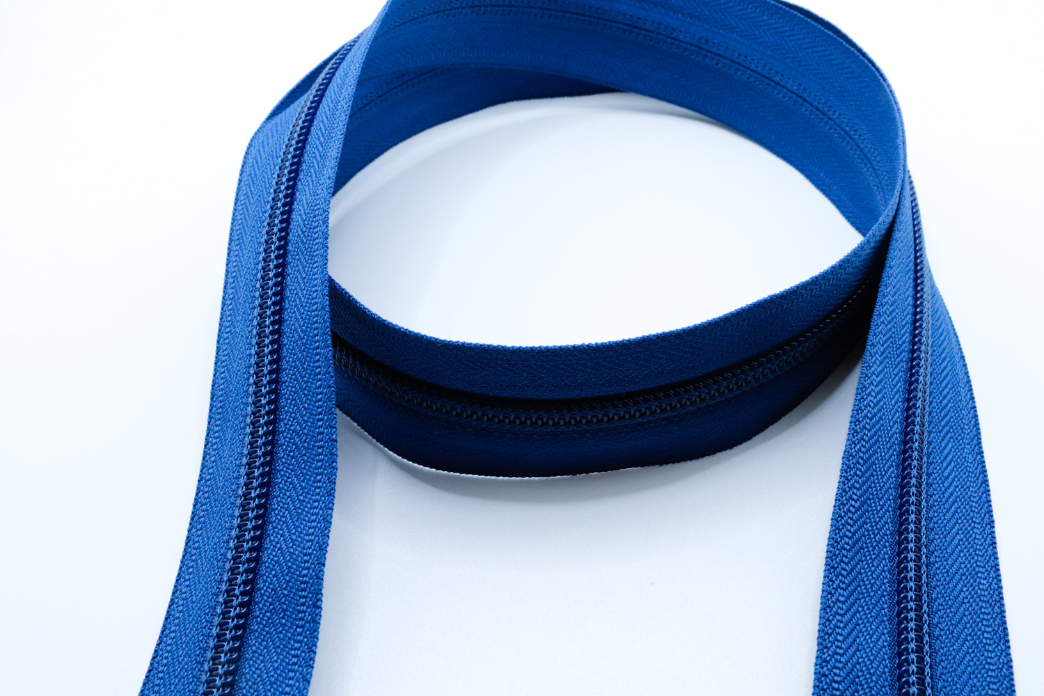 ocean blue YKK #5 coil zipper chain on a white background