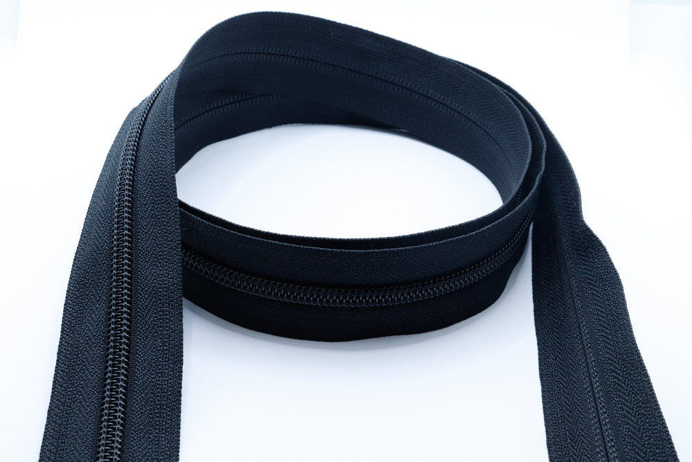 YKK coil zipper chain sold by the foot showing the continuous nylon spiral teeth