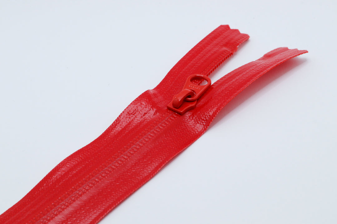 Red Closed-end YKK AquaGuard Zipper. Custom requests and bulk quantities available.