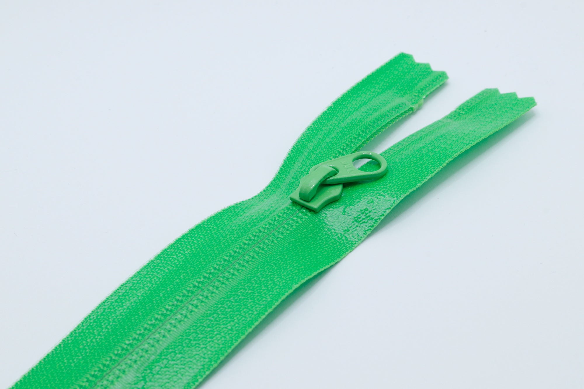 Green Closed-end YKK AquaGuard Zipper. Custom requests and bulk quantities available