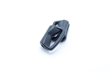 Black plastic piping clip shown from the side, a height-adjustable chest strap slider for packs