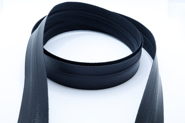 Size 8 black YKK AquaGuard water-resistant coil zipper by the foot for heavy-duty gear