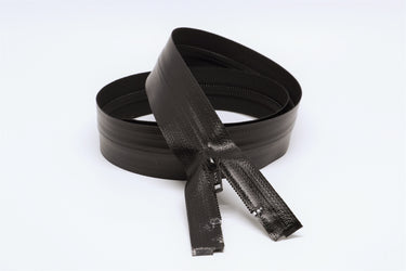 Close-up of black YKK AquaGuard zipper teeth showing the water-resistant laminate coil